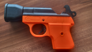 Record B1S Schreckschusspistole 6 mm Flobert orange integrierter Abschussbecher